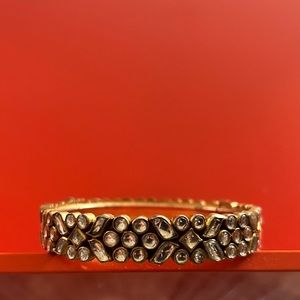 Thick cloister bangle bracelet with closure. Multi shape crystal and gold.